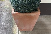 Pair of terracotta pots with artificial plants