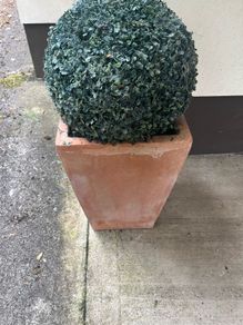 Pair of terracotta pots with artificial plants