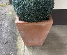 Pair of terracotta pots with artificial plants