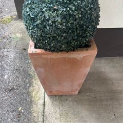 Pair of terracotta pots with artificial plants