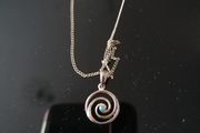 Sterling silver charm.