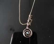 Sterling silver charm.