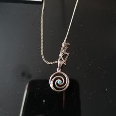 Sterling silver charm.