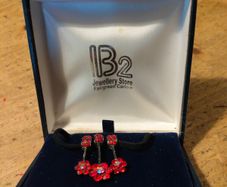 red poppy flower design Necklace  sold by independent jewelers like IB2 Jewellery Store. New in box.