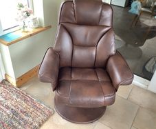 leather armchair with footstool. In perfect order. Back reclines when you sit in it. Very comfortable. Open to reasonable offers
