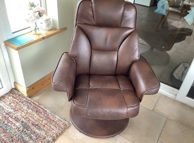 leather armchair with footstool. In perfect order. Back reclines when you sit in it. Very comfortable. Open to reasonable offers