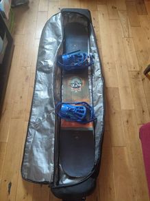 Salomon snowboard with Rossignol bindings in travel case