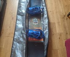 Salomon snowboard with Rossignol bindings in travel case