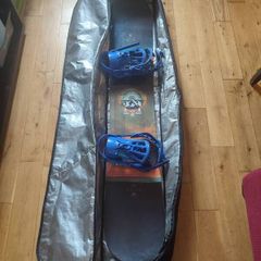 Salomon snowboard with Rossignol bindings in travel case