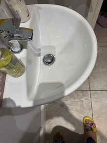 Bathroom sink, toilet, radiator