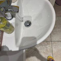Bathroom sink, toilet, radiator