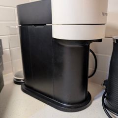Nespresso Vertuo Coffee Machine Bundle + Lavazza Frother, Chrome Pod Stand & 22 Pod Boxes