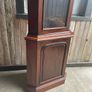 A tall mahogany corner cabinet. Image 2