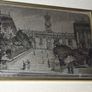 a picture with a silver plaque in the centre Image 3