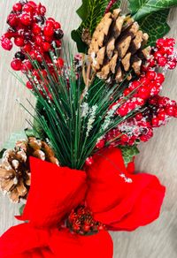 Collection of artificial red poinsettia and berry