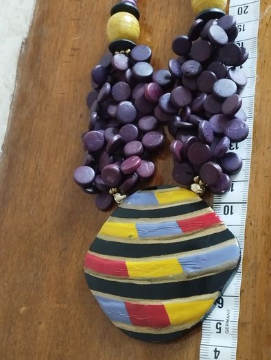 Vintage spectacular necklace made of wooden beads and medallion.