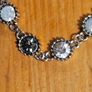 This matching silver-tone crystal necklace and bracelet set features alternating clear and black round stations with textured bezels.  SEE PHOTOS FOR SAME. Image 3