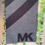 Authentic Michael Kors reversible knit scarf in charcoal black/heather grey with oversized MK logo detail. Image 2