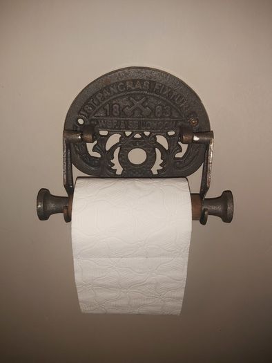Cast iron toilet holder