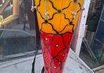 This Tall Bongo Hand Drum, a mechanical bolt tuning system with silver hardware around the top rim. The drum includes a vertical strap mechanism with Bag Stage or Movie Props