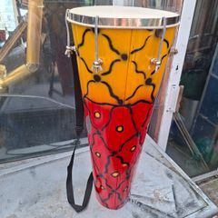 This Tall Bongo Hand Drum, a mechanical bolt tuning system with silver hardware around the top rim. The drum includes a vertical strap mechanism with Bag