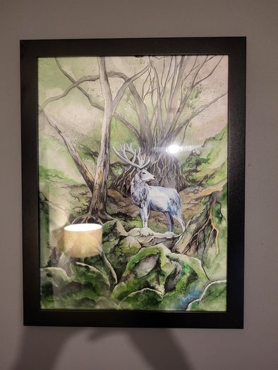 Watercolor painting with black frame. forest deer