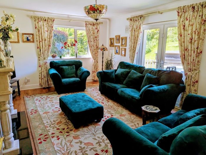 Elegant three piece suite with matching footstool