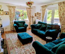 Elegant three piece suite with matching footstool