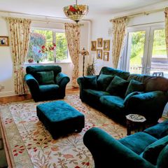 Elegant three piece suite with matching footstool