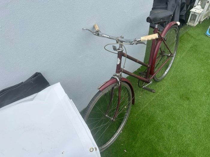 Vintage Triumph roadster (maroon, ladies step-through)