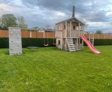 Large kids treehouse with play centre.