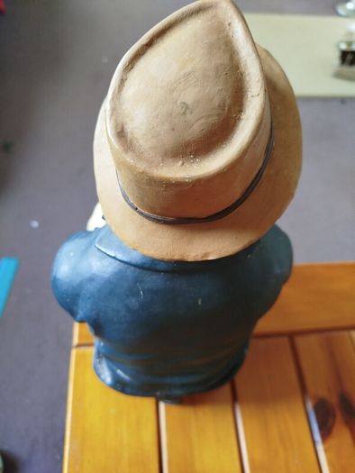 Resin sculpture of a seated boy