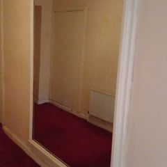 full-length mirror with an elegant arched top
