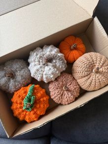 Box of crochet colourful pumpkins