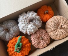 Box of crochet colourful pumpkins