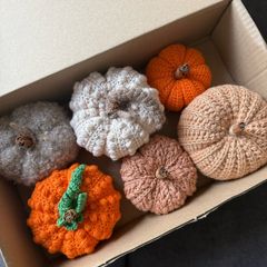Box of crochet colourful pumpkins