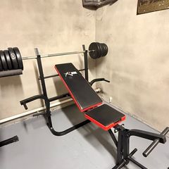 Gym bench, bar and weights.