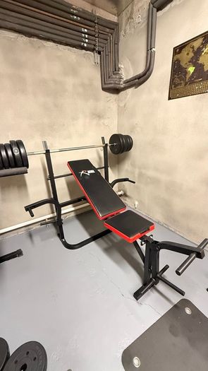 Gym bench, bar and weights.