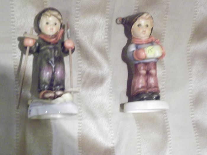 2 hummel figurines real hummel but are signed  ski heil skiar and for me