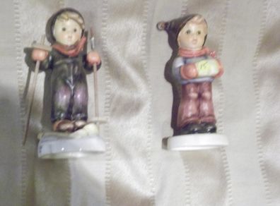 2 hummel figurines real hummel but are signed  ski heil skiar and for me