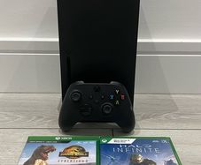 xbox series X with original controller and Jurassic World evolution two and halo infinity
