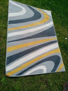 large rug 67 inches X 47 inches