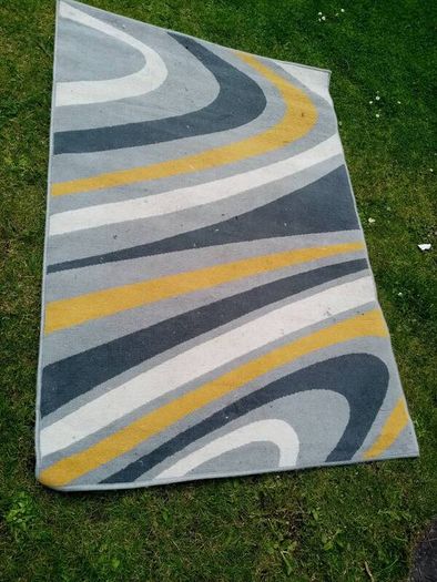 large rug 67 inches X 47 inches