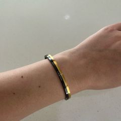 Calvin Klein black and gold bangle