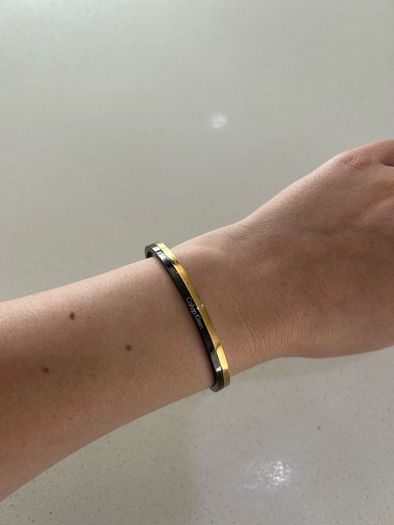 Calvin Klein black and gold bangle