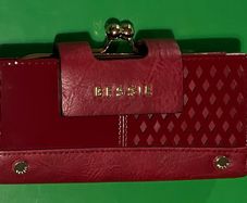 Bessie Ladies Wallet. Red in colour, new in box, purse section for coins and numerous slots for cards