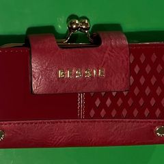 Bessie Ladies Wallet. Red in colour, new in box, purse section for coins and numerous slots for cards