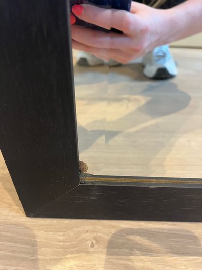 Black framed bevelled mirror