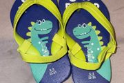Dinosaur flip flops