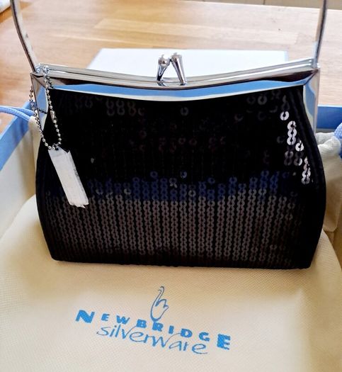 Newbridge black evening bag in box.